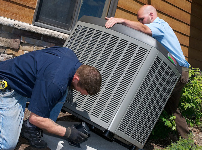 AC-Install_2-670×500 Country Thyme service techs installing a Lennox air conditioner