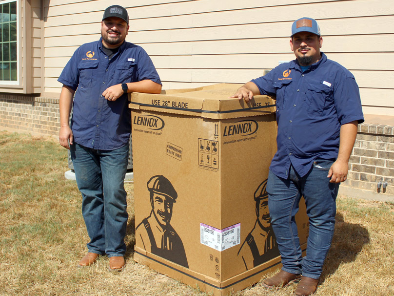 CT-AC-Install_1-808×606 Country Thyme service techs with a new Lennox AC unit before an installation