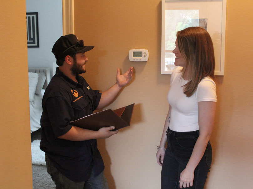 Thermostats-Product-808×606 Country Thyme service tech consulting homeowner about thermostat